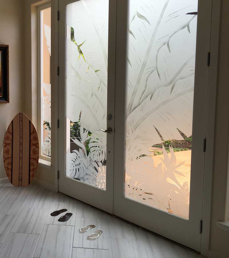 A door with two glass panels and a wooden floor