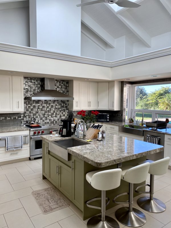 A kitchen with a large island and lots of counter space.